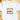 A white short-sleeve crewneck t-shirt laid flat on a light wood surface, featuring a colorful graphic print that reads 'CHRISTMAS HALLELUJAH' with Christmas ornaments and a gingerbread man illustration.