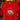 A red short-sleeve t-shirt hanging on a wooden hanger against a warm, festive background of a Christmas tree with lights and poinsettias. The shirt features a large graphic print in the center showing a snow globe with nutcracker figures, decorated with a red bow, green pine trees, and the text 'It's the most Wonderful Time of the Year'.